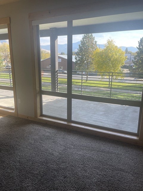 a room with a large window with a view of a park at Ashlyn Place, Missoula, 59801